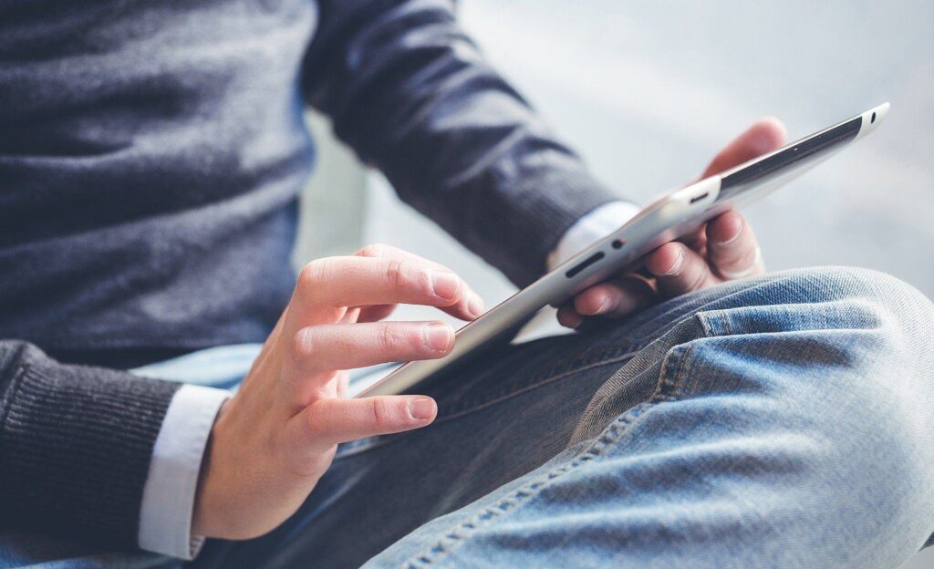 Canadian entrepreneur reviewing business finances with tablet