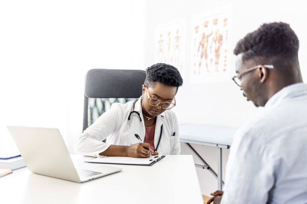 A professional healthcare practitioner working on financial documents.